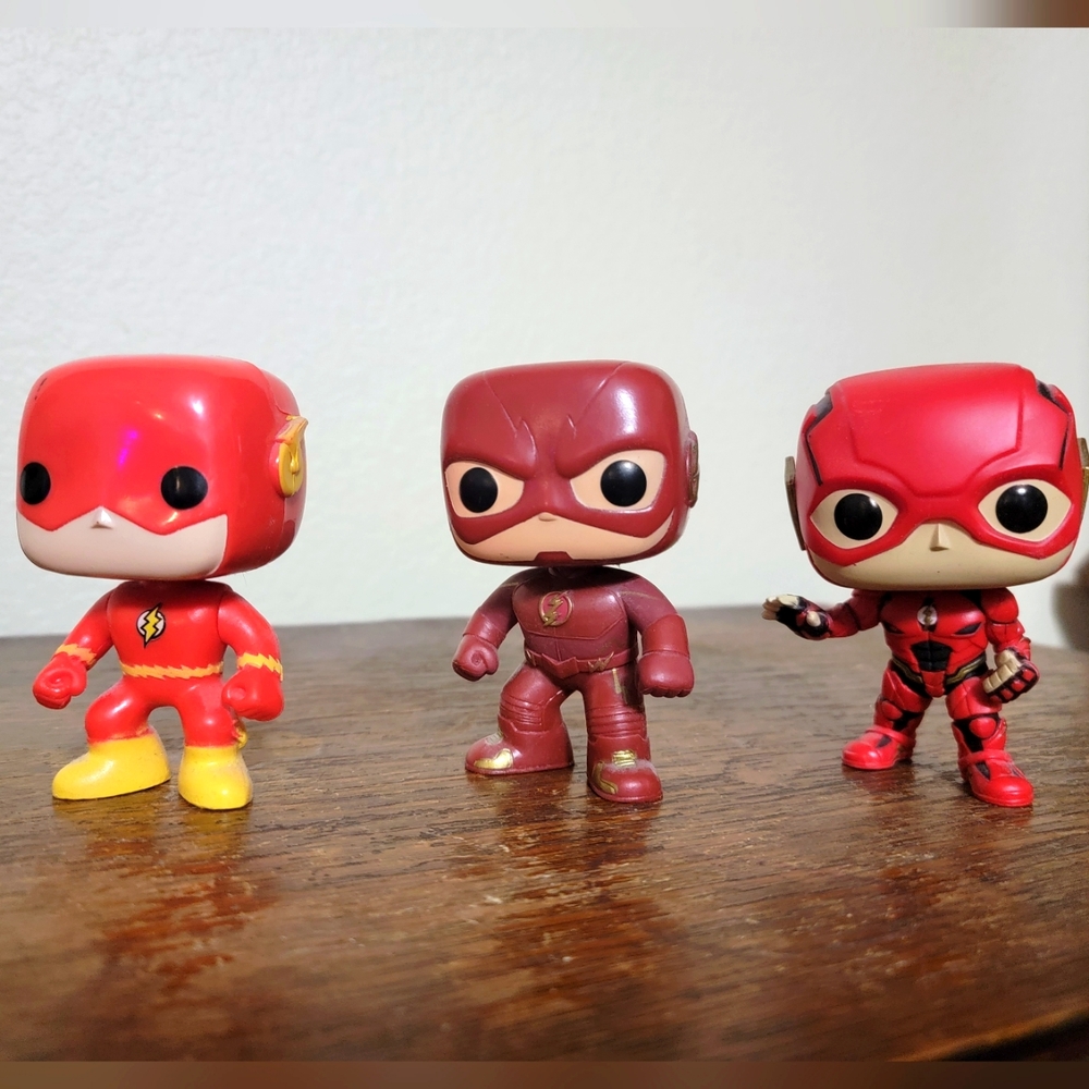 Three Funko Pop Flash figurines